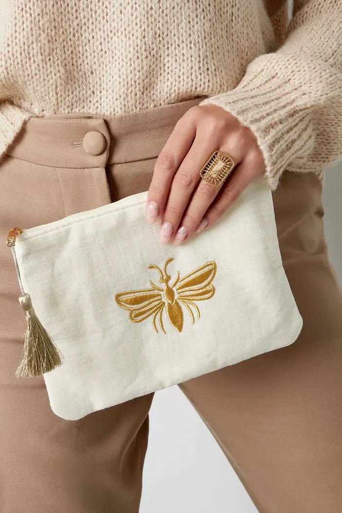 Make-up bag with golden bee