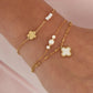 double bracelet with pearls and clover charm